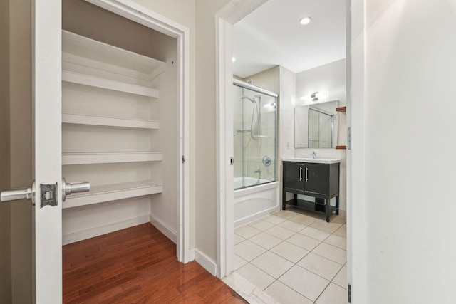 20 Newport Pkwy Unit 1006, Jersey City, NJ 07310 - bathroom with shower / bath combination with glass door, vanity, and wood finished floors