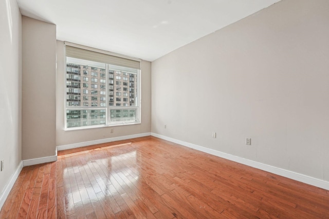 20 Newport Pkwy Unit 1006, Jersey City, NJ 07310 - spare room with light wood-style floors and baseboards