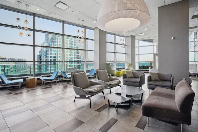 20 Newport Pkwy Unit 1006, Jersey City, NJ 07310 - common area with a towering ceiling, a wall of windows, a city view, and a drop ceiling