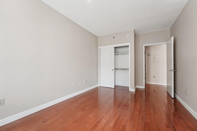 20 Newport Pkwy Unit 1006, Jersey City, NJ 07310 - unfurnished bedroom with a closet, wood finished floors, and baseboards