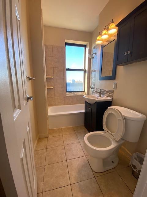 680 Kennedy Blvd Unit 406, Bayonne, NJ 07002 - full bathroom featuring tile patterned floors, toilet, vanity, and bathtub / shower combination