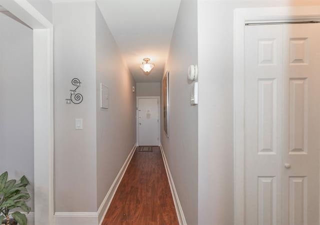 680 Kennedy Blvd Unit 406, Bayonne, NJ 07002 - hall with dark wood-style floors and baseboards