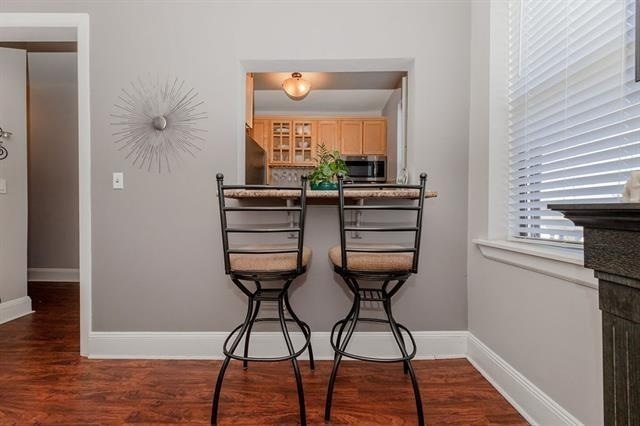 680 Kennedy Blvd Unit 406, Bayonne, NJ 07002 - dining space featuring wood finished floors and baseboards