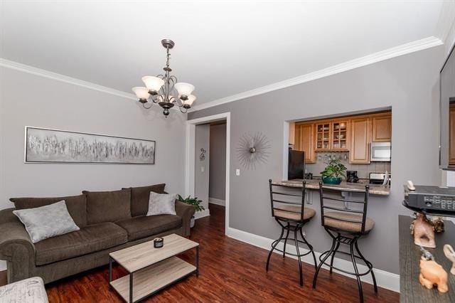 680 Kennedy Blvd Unit 406, Bayonne, NJ 07002 - living area featuring a chandelier, crown molding, baseboards, and dark wood finished floors