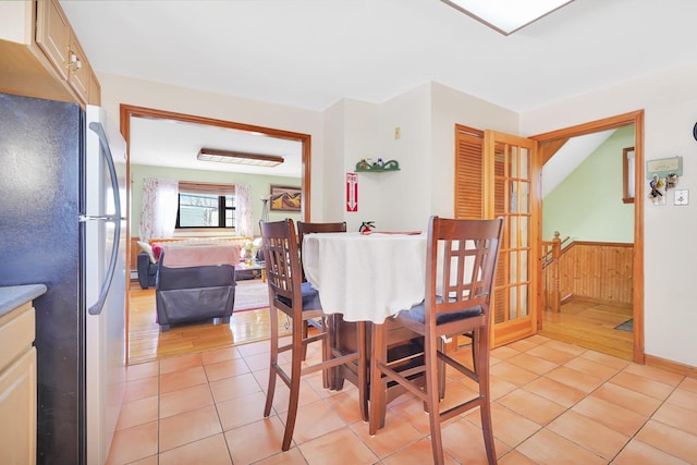 dining area with light tile patterned floors