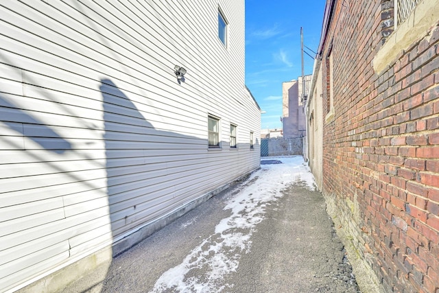 view of side of property with fence