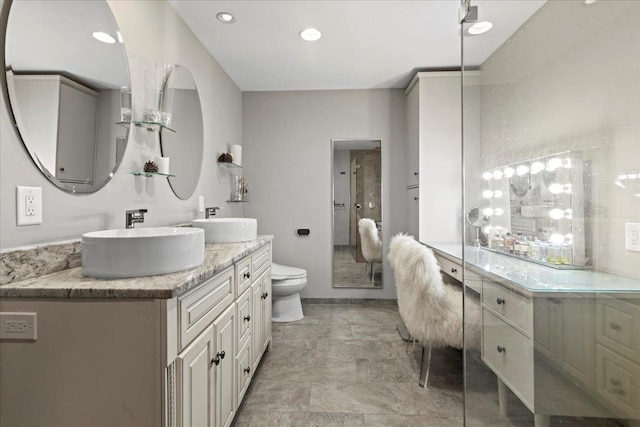 498 Teal Plz, Secaucus, NJ 07094 - full bathroom with double vanity, toilet, recessed lighting, and baseboards