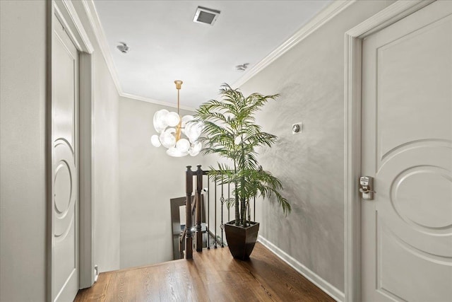 498 Teal Plz, Secaucus, NJ 07094 - foyer entrance featuring a chandelier, wood finished floors, crown molding, and baseboards