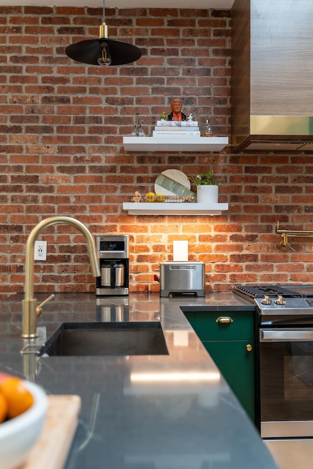 72 Lincoln St Unit 2, Jersey City, NJ 07307 - kitchen featuring gas stove, stainless steel countertops, and a sink