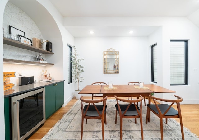 72 Lincoln St Unit 2, Jersey City, NJ 07307 - dining area featuring beverage cooler, light wood-type flooring, a bar, baseboards, and recessed lighting