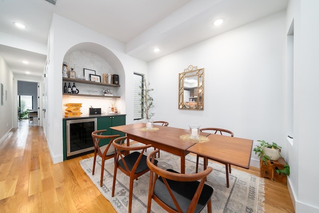 72 Lincoln St Unit 2, Jersey City, NJ 07307 - dining area with wine cooler, a dry bar, light wood-style floors, recessed lighting, and baseboards