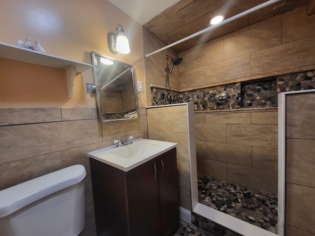 403 Hamilton St, Roselle Boro, NJ 07203 - bathroom with vanity, a tile shower, toilet, and tile walls