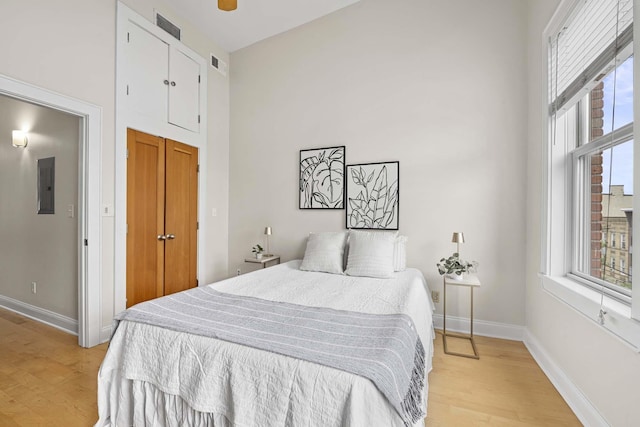 512 Jefferson St Unit 4R, Hoboken, NJ 07030 - bedroom featuring electric panel, light wood-style floors, and a closet