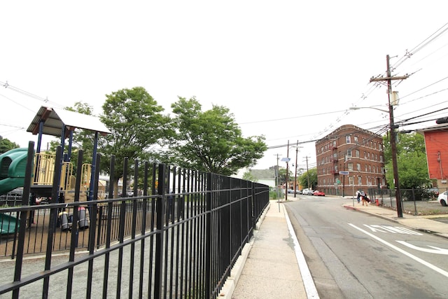 154 Fairmount Ave, Jersey City, NJ 07304 - view of asphalt street featuring sidewalks, street lights, and curbs