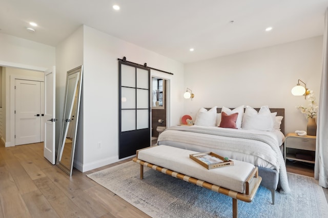 bedroom featuring recessed lighting, baseboards, and light wood-style floors