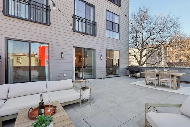 view of patio / terrace featuring outdoor lounge area, outdoor dining area, and grilling area