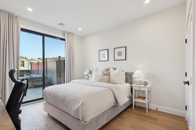 bedroom featuring access to exterior, light wood-style flooring, recessed lighting, and baseboards