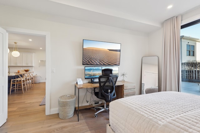 bedroom featuring recessed lighting, light wood-style flooring, baseboards, and access to outside