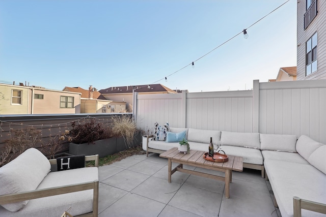 view of patio / terrace with an outdoor hangout area and fence