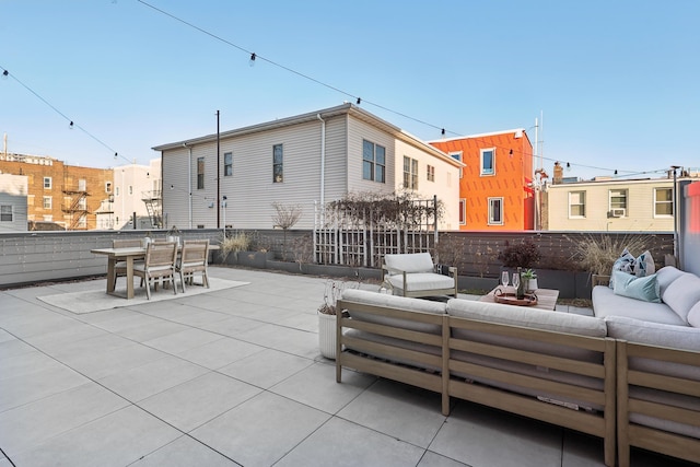 view of patio / terrace with outdoor lounge area, outdoor dining space, and fence