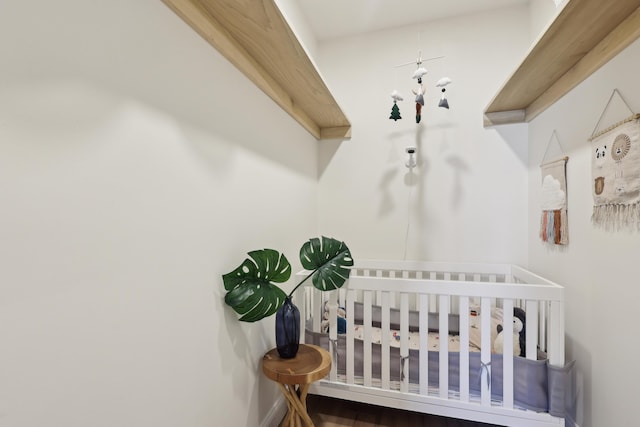 bedroom featuring a nursery area