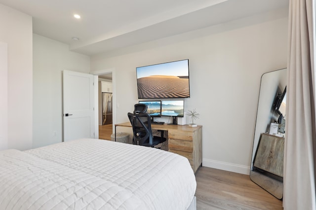 bedroom with recessed lighting, stainless steel fridge, light wood-style flooring, and baseboards