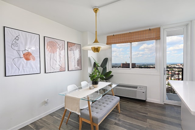 dining space featuring dark hardwood / wood-style floors and a wall mounted AC