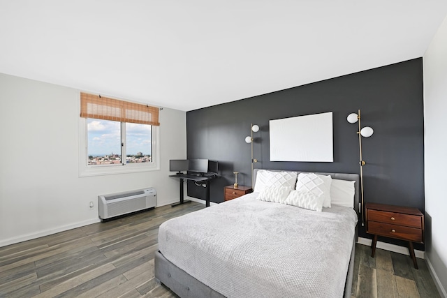 bedroom featuring dark wood-type flooring and a wall mounted AC