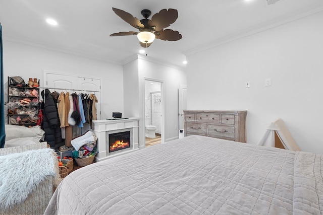 42 Grace St Unit 2, Jersey City, NJ 07307 - bedroom with a closet, crown molding, wood finished floors, recessed lighting, and a lit fireplace