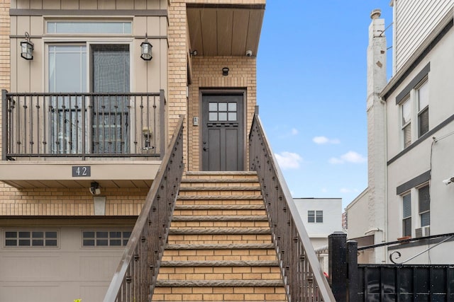 42 Grace St Unit 2, Jersey City, NJ 07307 - doorway to property with an attached garage and brick siding