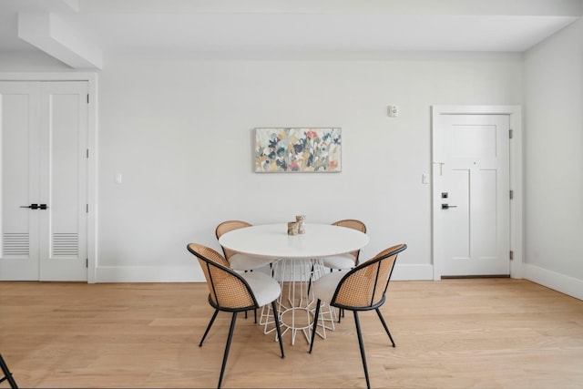 dining area featuring light wood-type flooring