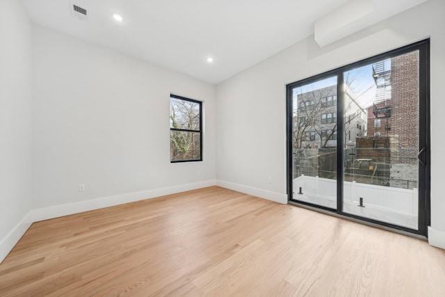 unfurnished room featuring light hardwood / wood-style flooring