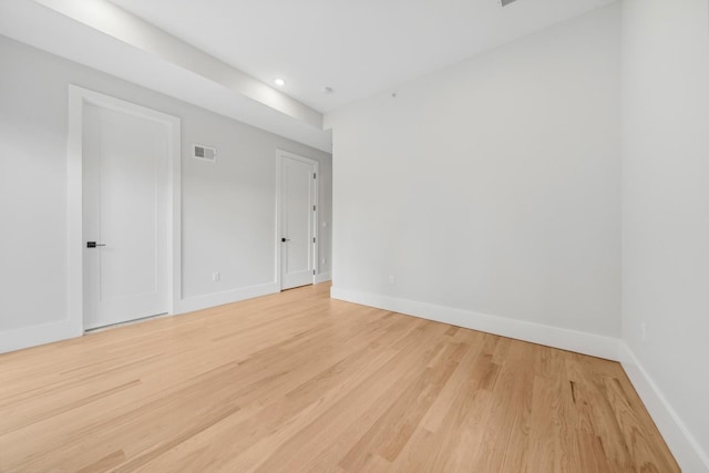 unfurnished room with light hardwood / wood-style floors