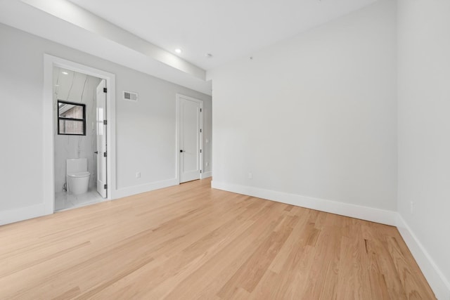 empty room with light hardwood / wood-style floors