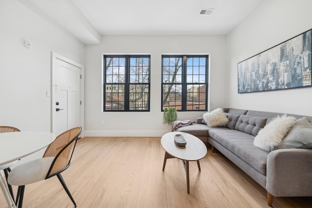 living room with light hardwood / wood-style floors