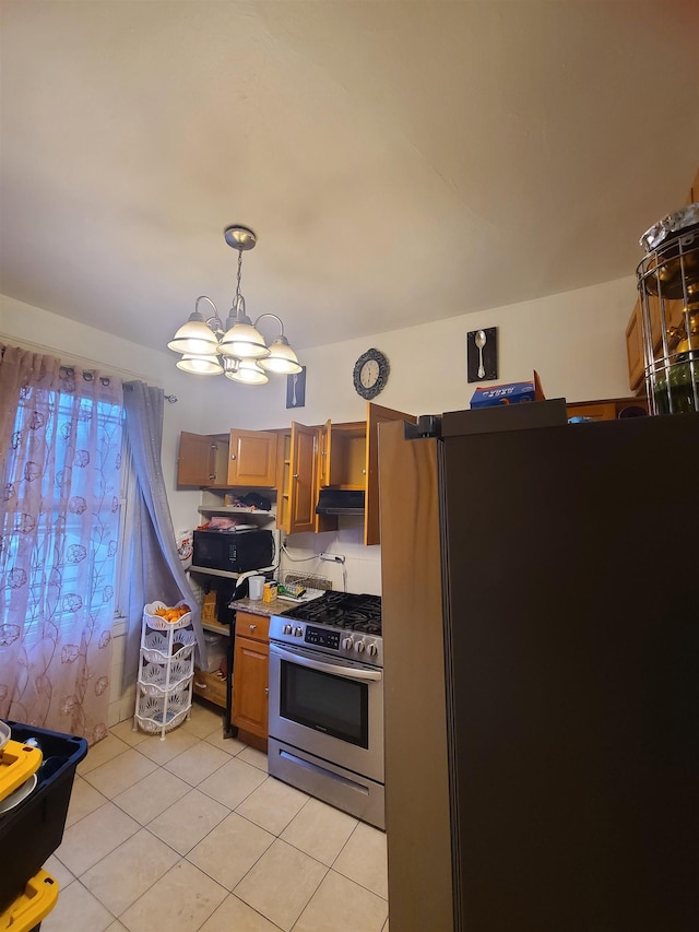 kitchen with open shelves, freestanding refrigerator, black microwave, under cabinet range hood, and gas range