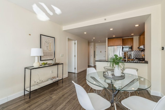 dining room featuring dark wood-type flooring