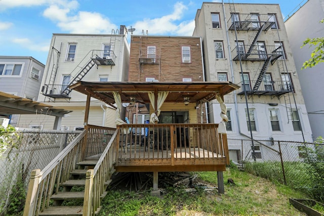 215 48th St Unit 101, Union City, NJ 07087 - back of property with a deck and a ceiling fan