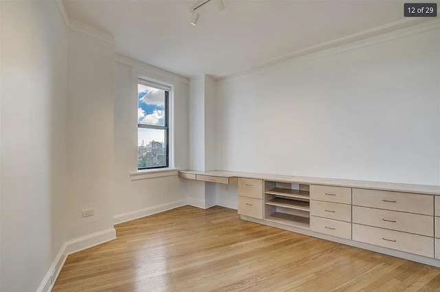 2600 Kennedy Blvd Unit 7A, Jersey City, NJ 07306 - unfurnished office featuring built in desk, light wood-style flooring, crown molding, and rail lighting