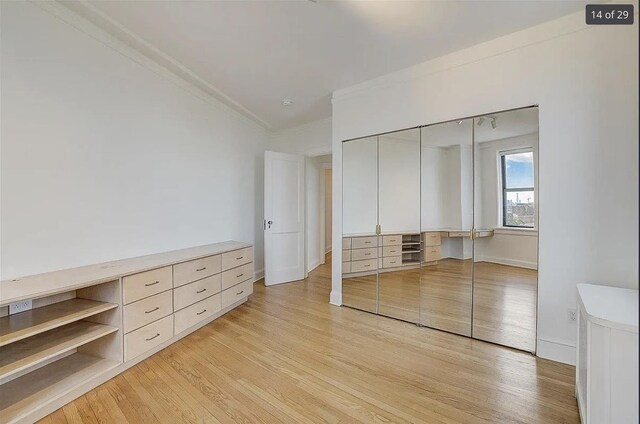 2600 Kennedy Blvd Unit 7A, Jersey City, NJ 07306 - unfurnished bedroom featuring light wood-type flooring, crown molding, and a closet