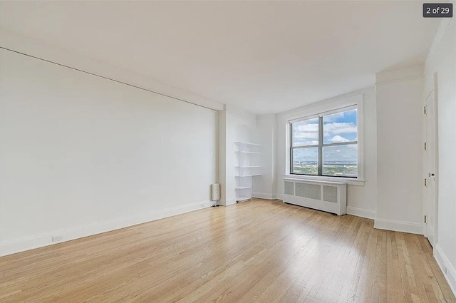2600 Kennedy Blvd Unit 7A, Jersey City, NJ 07306 - spare room featuring radiator and light wood finished floors