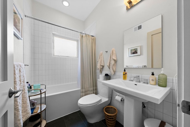 390 1st St Unit 3, Jersey City, NJ 07302 - bathroom with shower / bath combo, tile patterned floors, and tile walls