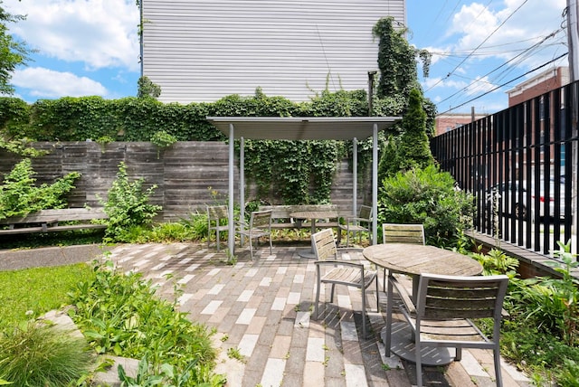 390 1st St Unit 3, Jersey City, NJ 07302 - fenced backyard featuring outdoor dining space and a patio area