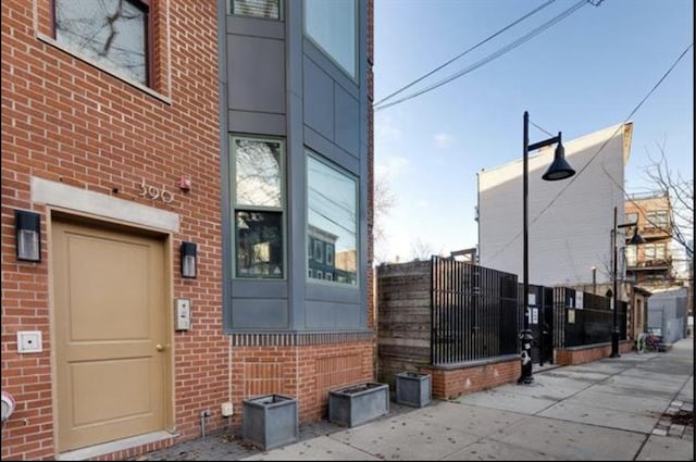 390 1st St Unit 3, Jersey City, NJ 07302 - view of exterior entry featuring brick siding