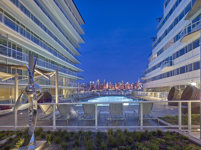800 Ave At Port Imperial Unit 517, Weehawken, NJ 07086 - view of home's community featuring a swimming pool and a view of city lights