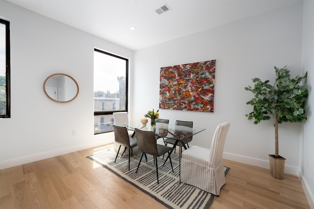 dining space featuring light hardwood / wood-style floors