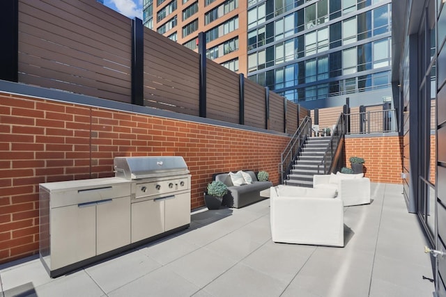 view of patio featuring stairs, area for grilling, and grilling area