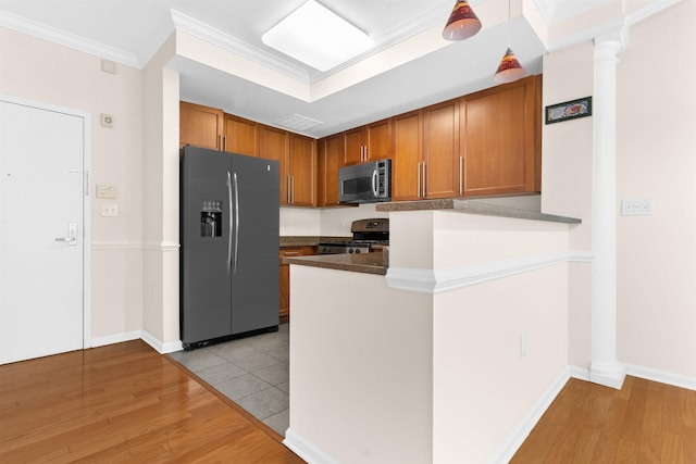 15 Freedom Way Unit 212, Jersey City, NJ 07305 - kitchen featuring stainless steel appliances, light wood-style flooring, brown cabinets, and ornamental molding