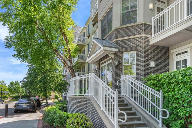 15 Freedom Way Unit 212, Jersey City, NJ 07305 - full bath with vanity, tile patterned flooring, tiled shower / bath, and crown molding