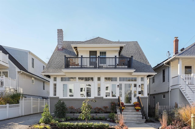 rear view of house with a balcony